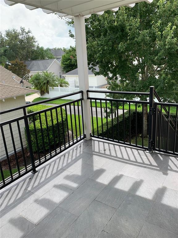 910 Pawstand Road Celebration, FL 34747 - Photo 8 of 33 a view of balcony with wooden floor