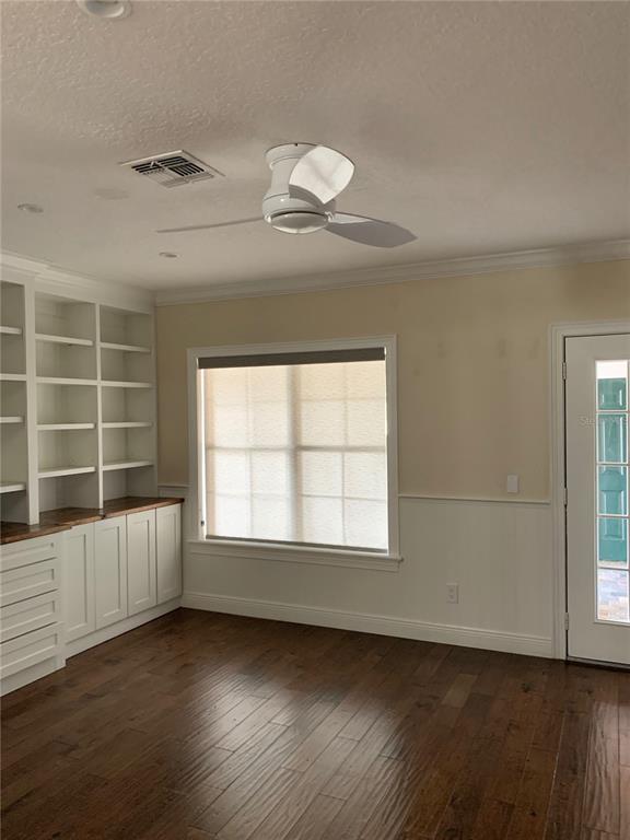 910 Pawstand Road Celebration, FL 34747 - Photo 10 of 33 an empty room with wooden floor and windows