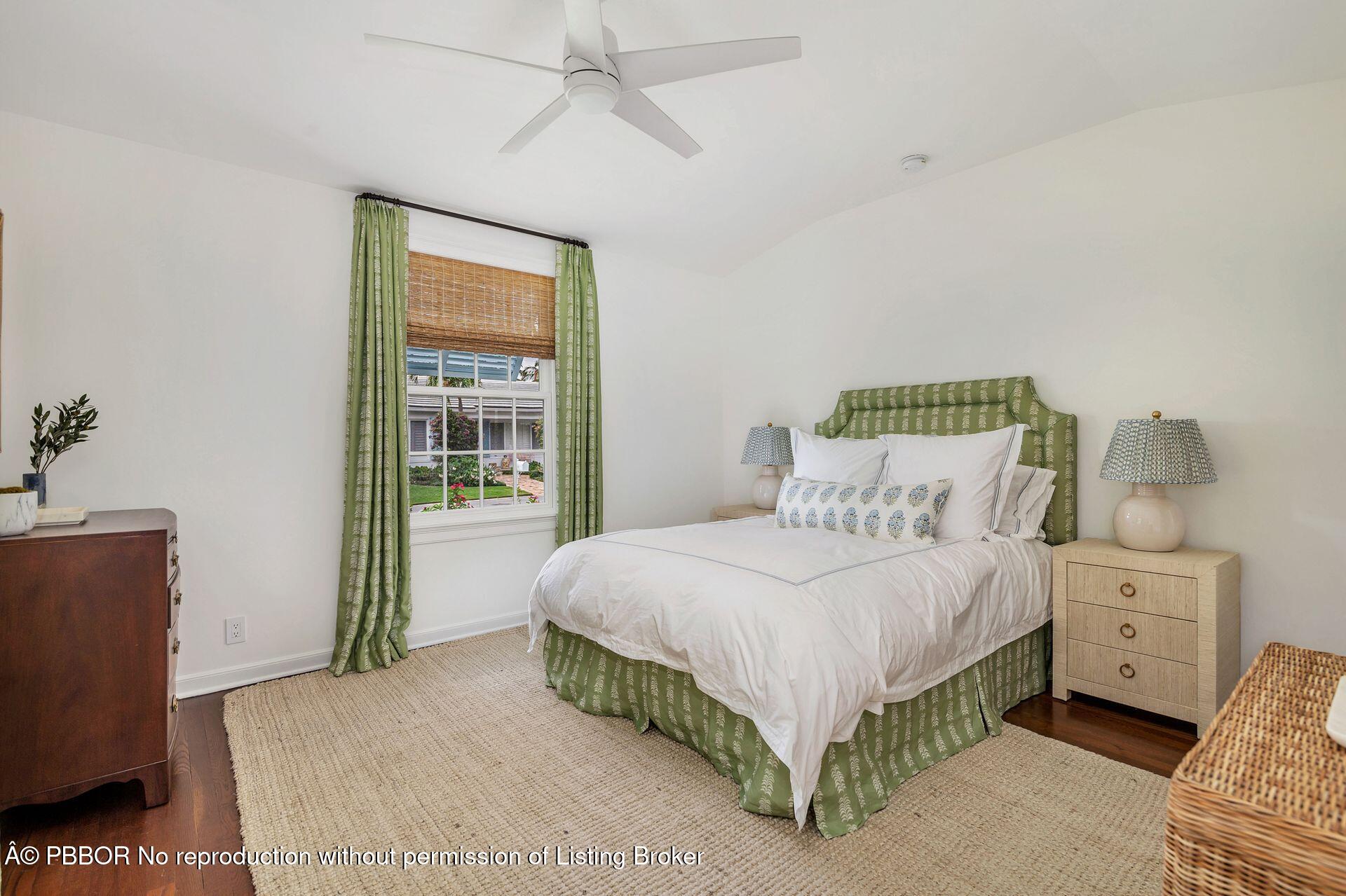 255 Colonial Lane Palm Beach, FL 33480 - Photo 21 of 32 a bedroom with a bed and a window