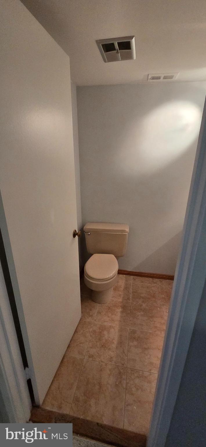 11764 Indian Ridge Road Reston, VA 20191 - Photo 23 of 31 a bathroom with a toilet