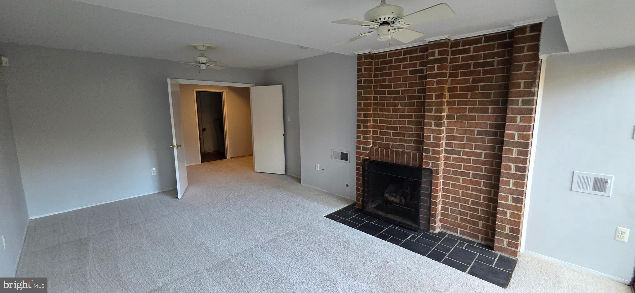 11764 Indian Ridge Road Reston, VA 20191 - Photo 30 of 31 a view of an empty room with a fireplace and a window