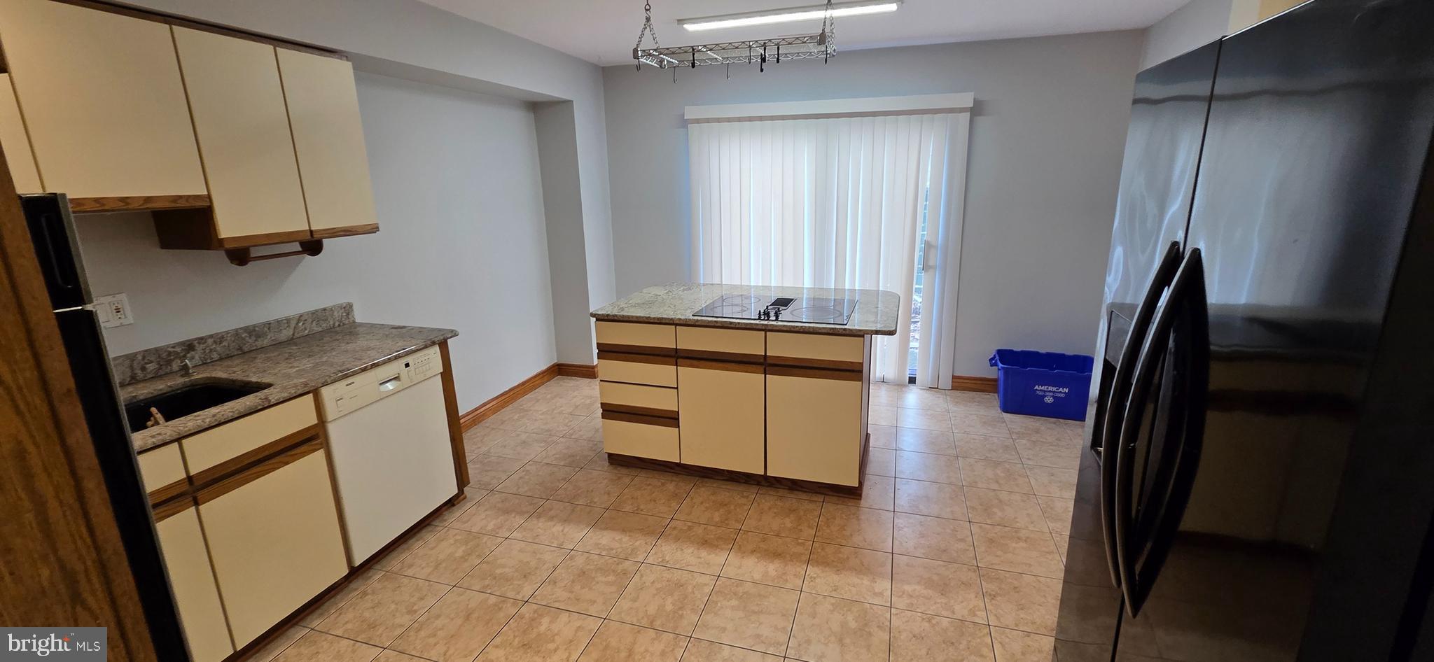 11764 Indian Ridge Road Reston, VA 20191 - Photo 6 of 31 a kitchen with a sink stove and refrigerator