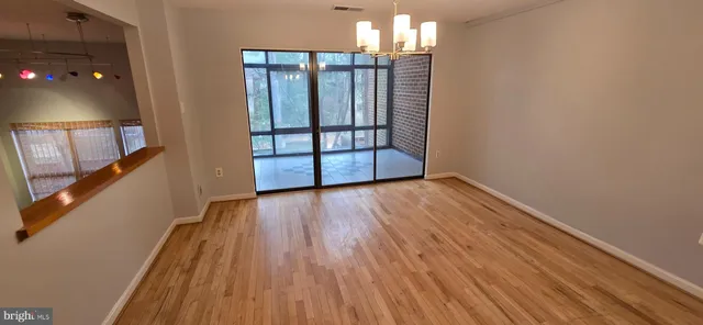 a view of entryway with wooden floor