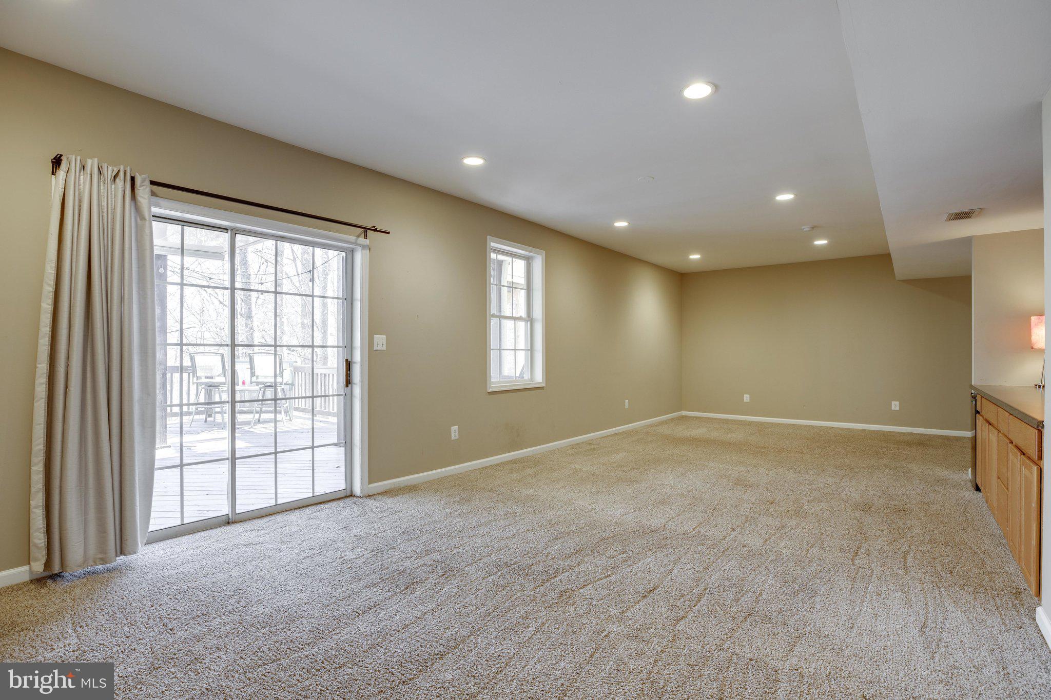 6363 Yates Ford Road Manassas, VA 20111 - Photo 36 of 53 Sliding Glass Doors Open to Lower Level Deck