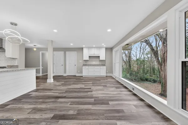 a view of a kitchen with a sink and cabinets
