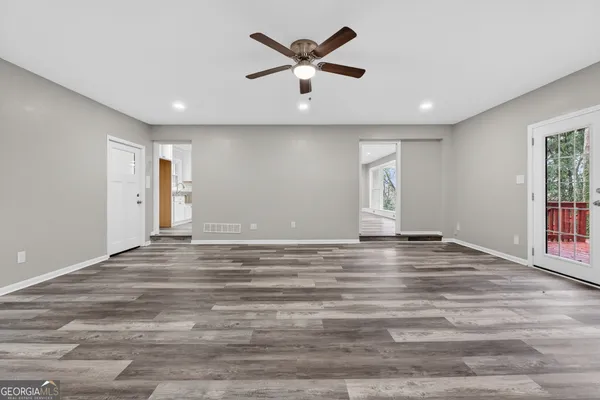 a view of an empty room with a window