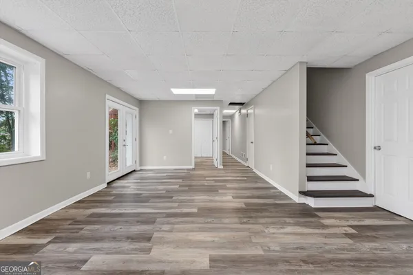 a view of entryway with stairs and white walls