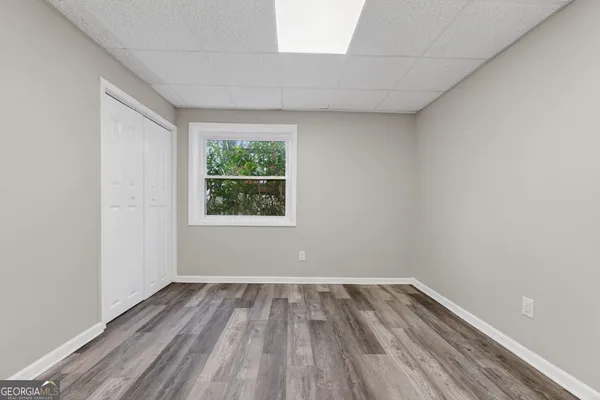 a view of room with window and hardwood floor