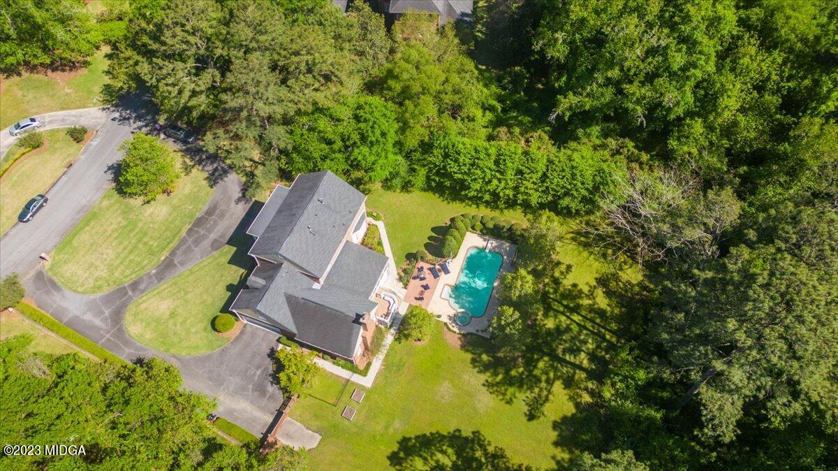 1158 St Andrews Drive Macon, GA 31210 - Photo 2 of 79 an aerial view of a house with swimming pool and garden space