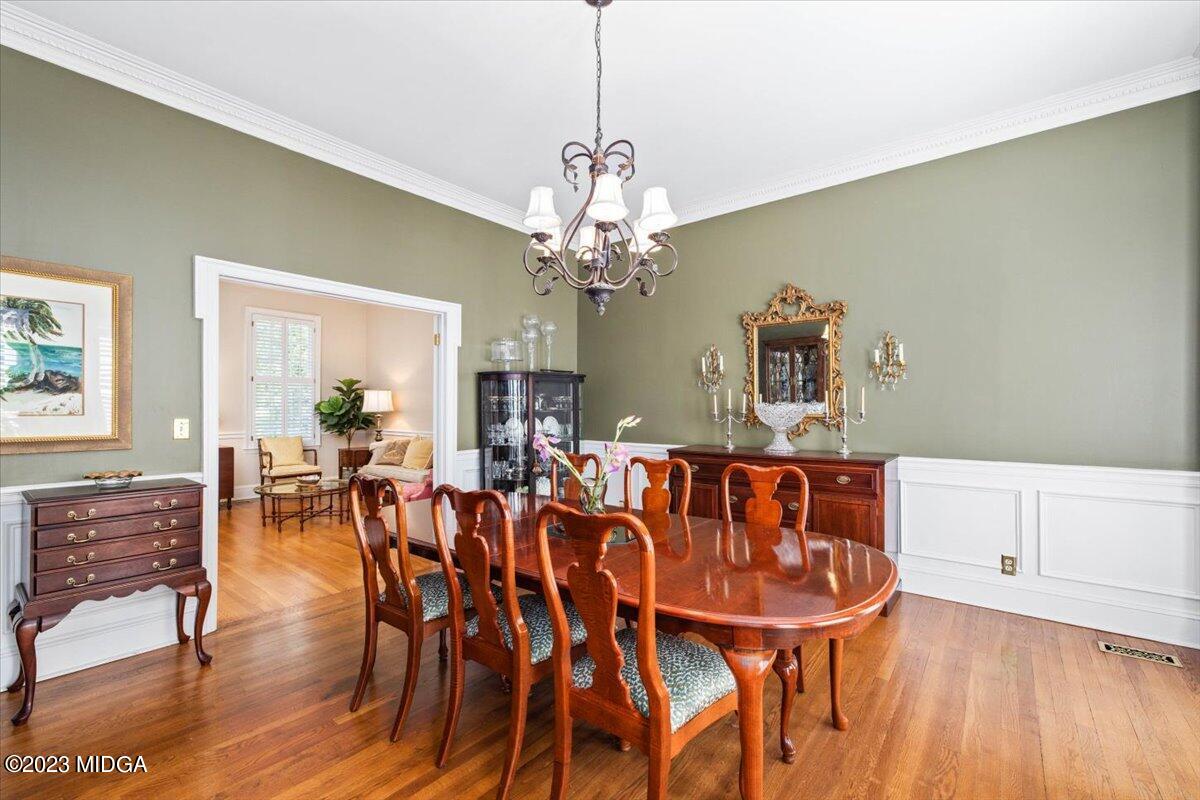 1158 St Andrews Drive Macon, GA 31210 - Photo 23 of 79 a view of a dining room with furniture and wooden floor