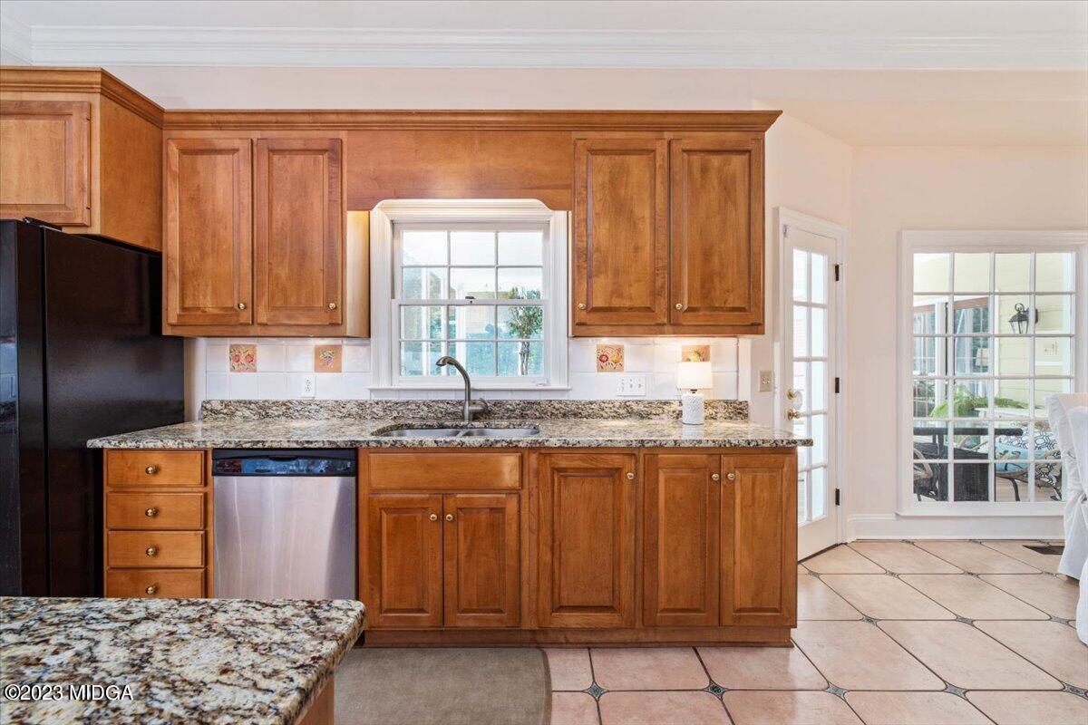 1158 St Andrews Drive Macon, GA 31210 - Photo 25 of 79 a kitchen with stainless steel appliances granite countertop a stove a sink dishwasher and a refrigerator