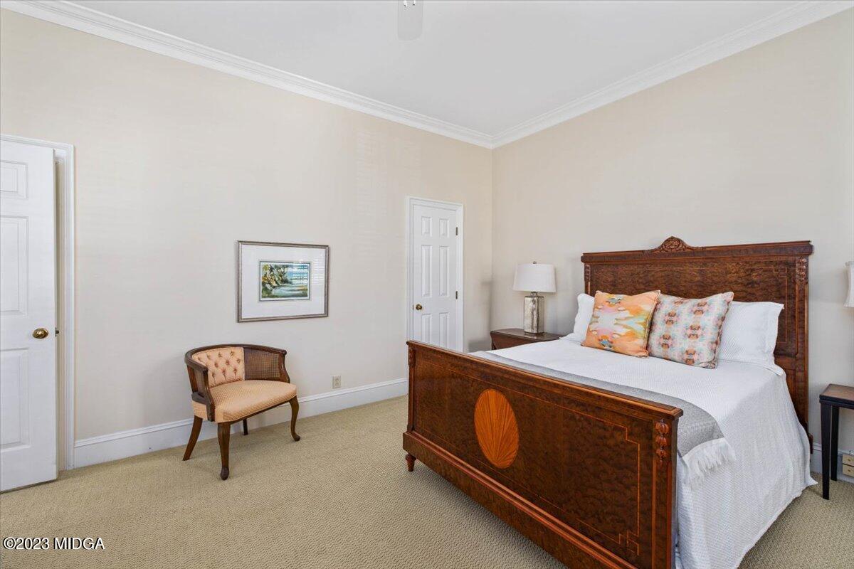 1158 St Andrews Drive Macon, GA 31210 - Photo 29 of 79 a bedroom with a bed and a chair