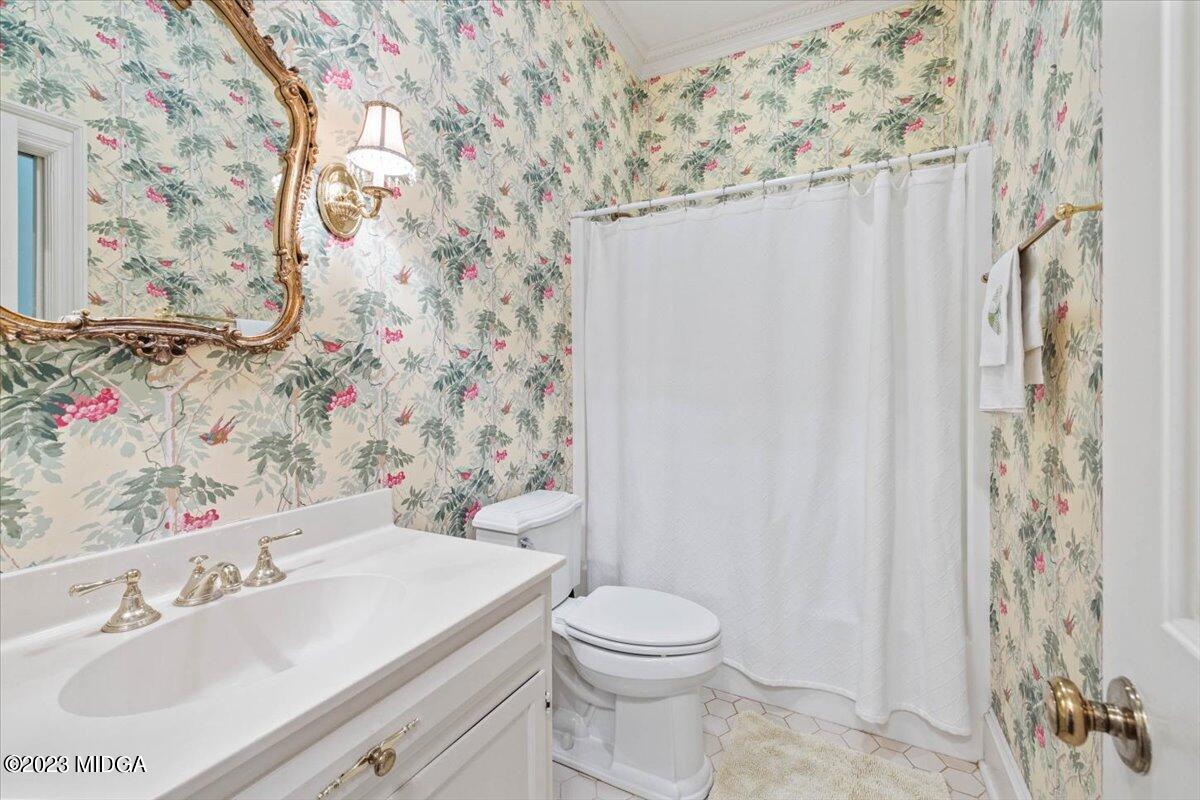 1158 St Andrews Drive Macon, GA 31210 - Photo 30 of 79 a bathroom with a sink toilet and shower