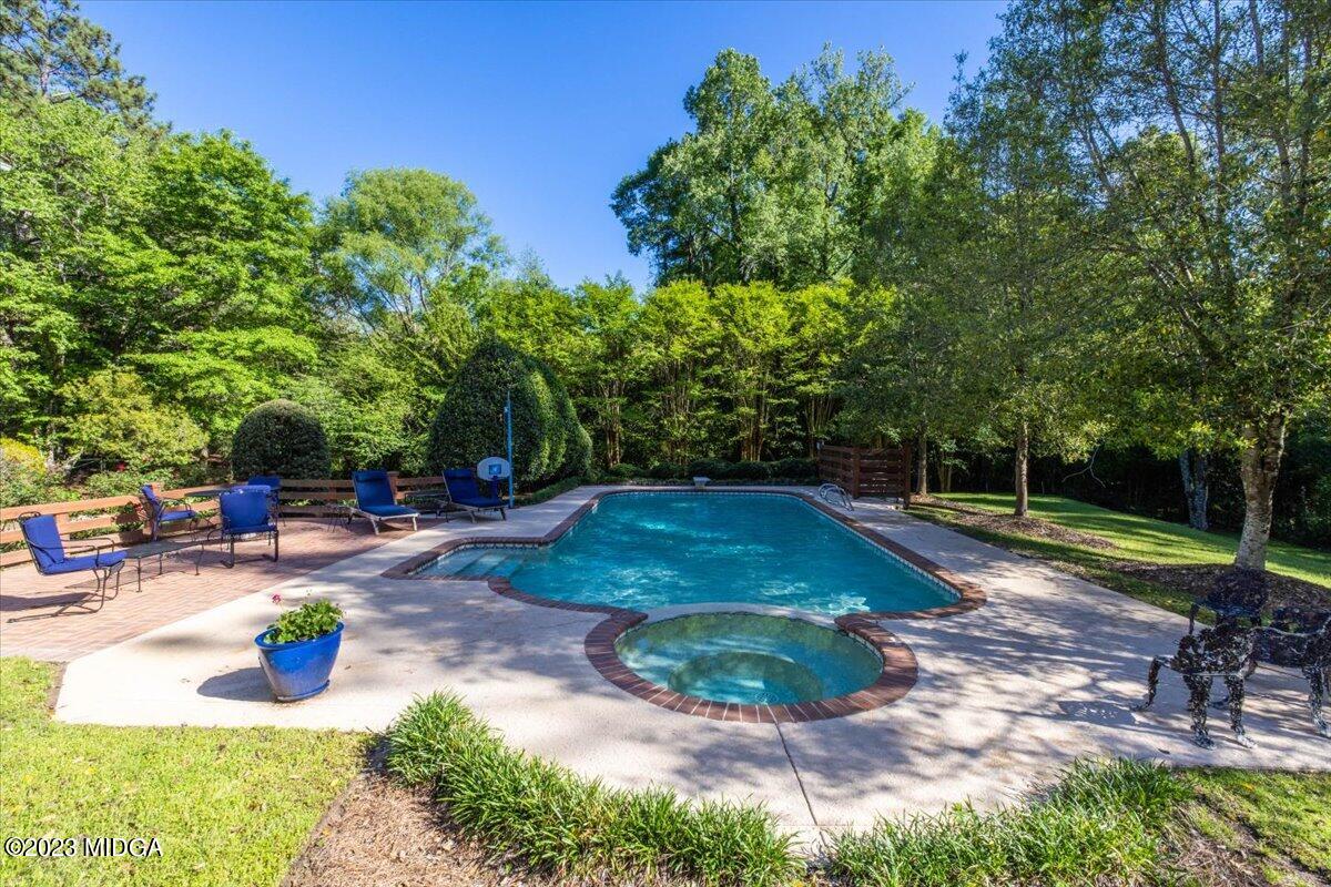 1158 St Andrews Drive Macon, GA 31210 - Photo 4 of 79 a view of a backyard with swimming pool