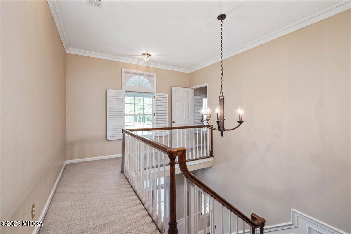 1158 St Andrews Drive Macon, GA 31210 - Photo 42 of 79 a view of a hallway with windows