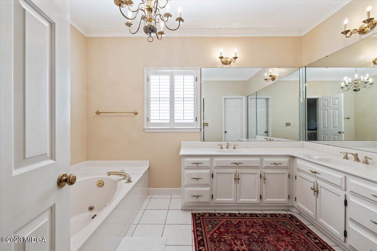 1158 St Andrews Drive Macon, GA 31210 - Photo 44 of 79 a spacious bathroom with a tub sink and mirror