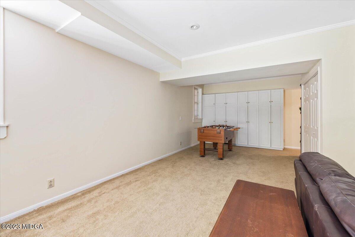 1158 St Andrews Drive Macon, GA 31210 - Photo 51 of 79 a living room with a couch and a rug
