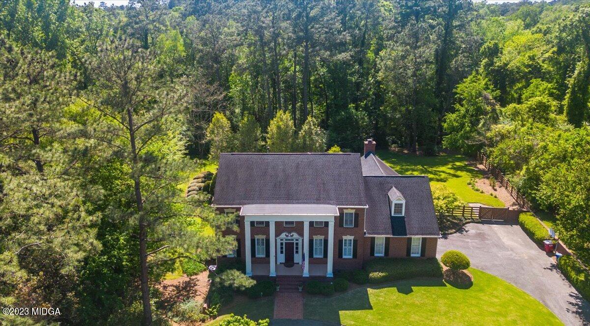 1158 St Andrews Drive Macon, GA 31210 - Photo 62 of 79 aerial view of a house with swimming pool next to a big yard