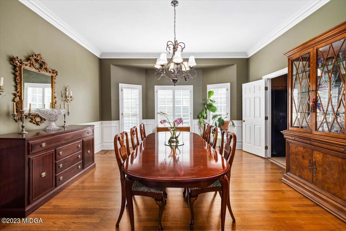 1158 St Andrews Drive Macon, GA 31210 - Photo 10 of 79 a view of a dining room with furniture window and wooden floor