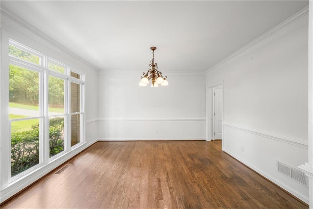 1710 Rising Mist Lane Cumming, GA 30041 - Photo 28 of 111 a view of empty room with wooden floor and fan