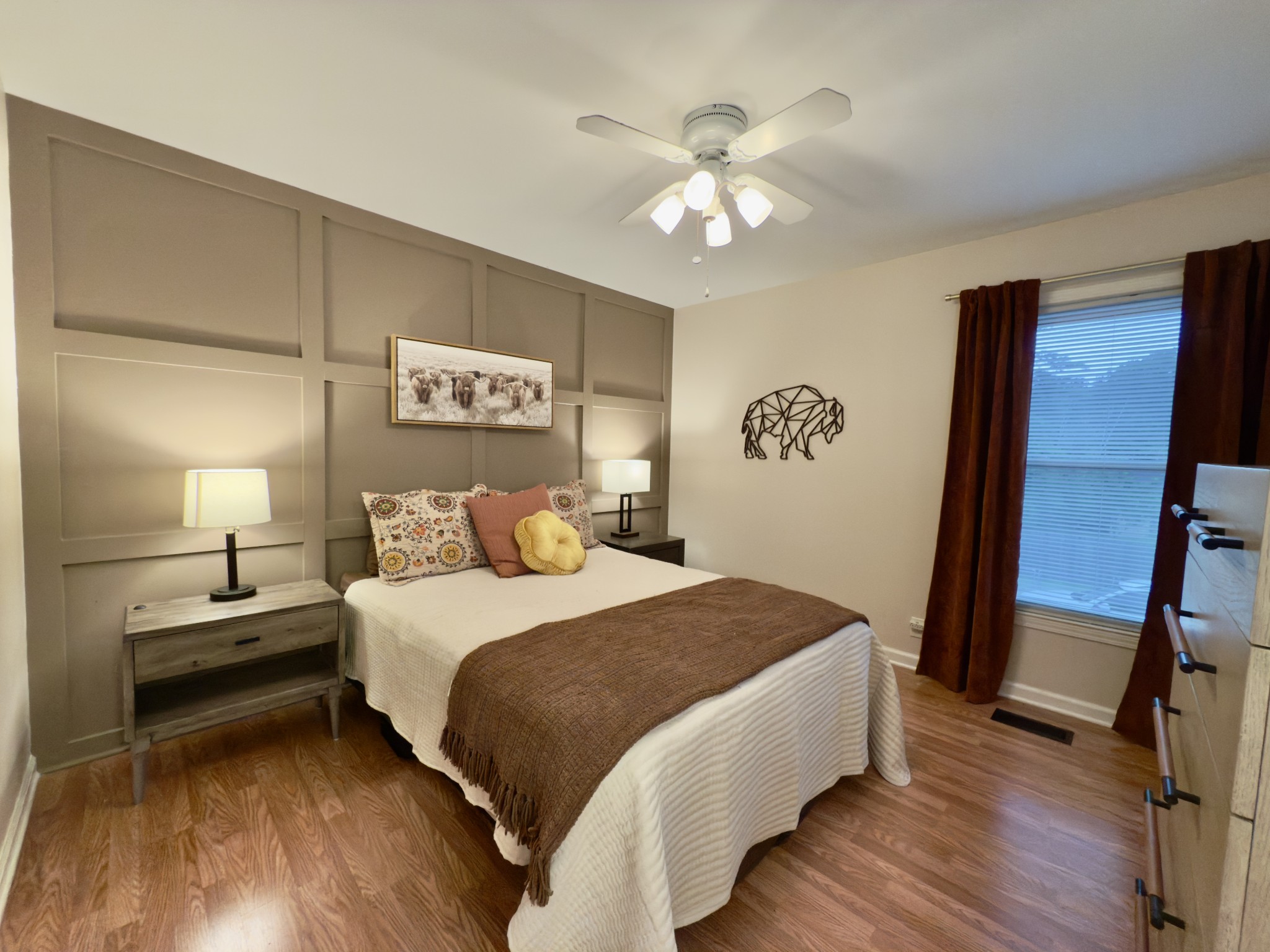 705 Baugh Road Nashville, TN 37221 - Photo 18 of 31 a bedroom with a bed and a chandelier