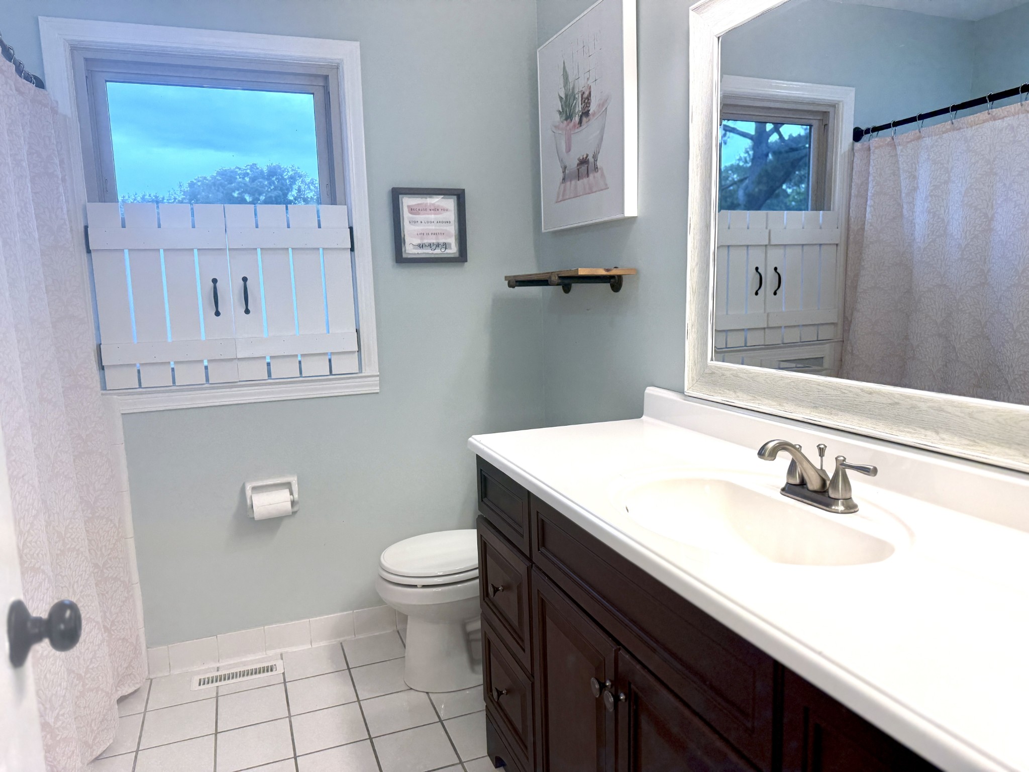 705 Baugh Road Nashville, TN 37221 - Photo 19 of 31 a bathroom with a sink a toilet and mirror