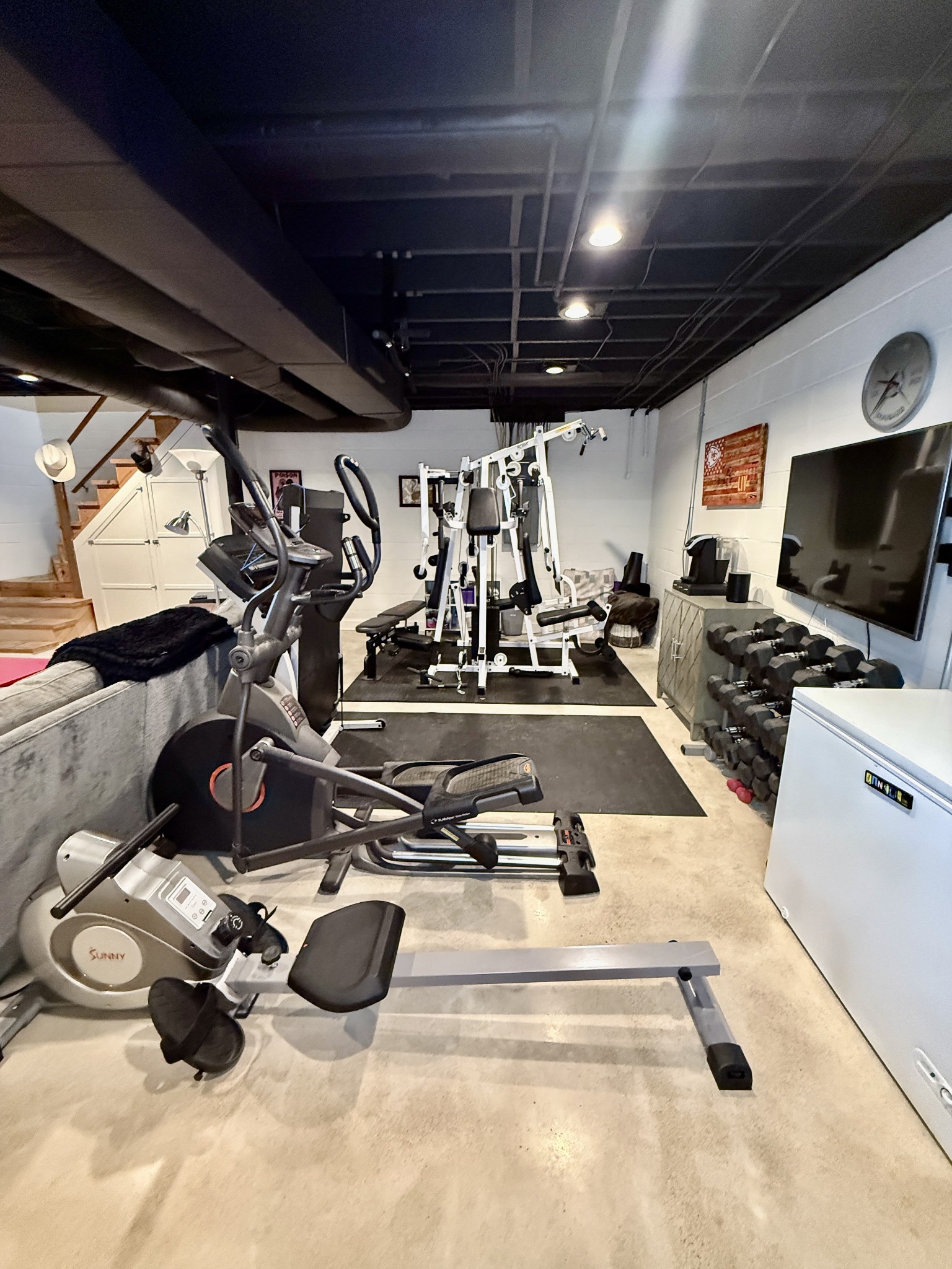 705 Baugh Road Nashville, TN 37221 - Photo 23 of 31 a room with gym equipment and a mirror
