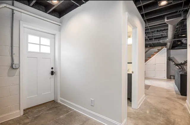 a view of water heater room with furniture