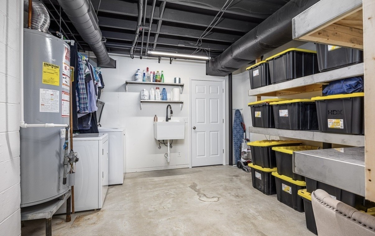705 Baugh Road Nashville, TN 37221 - Photo 26 of 31 a view of water heater room with furniture