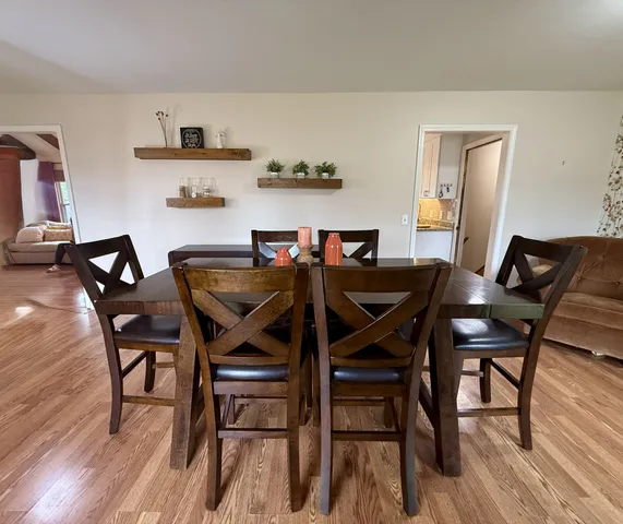 a kitchen with stainless steel appliances granite countertop a sink a stove and a refrigerator