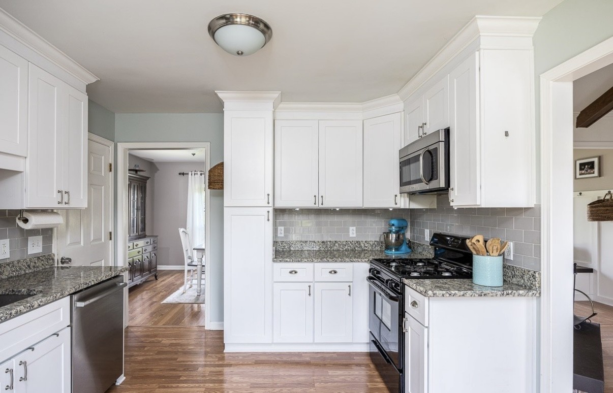 705 Baugh Road Nashville, TN 37221 - Photo 9 of 31 a kitchen with stainless steel appliances granite countertop a sink a stove and a refrigerator