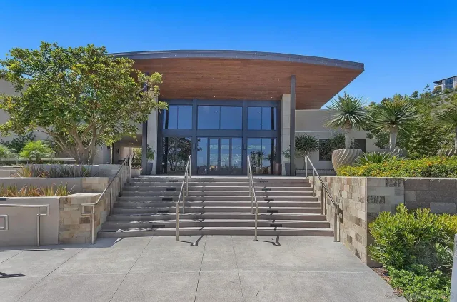a view of a chairs and tables in the back yard of the house