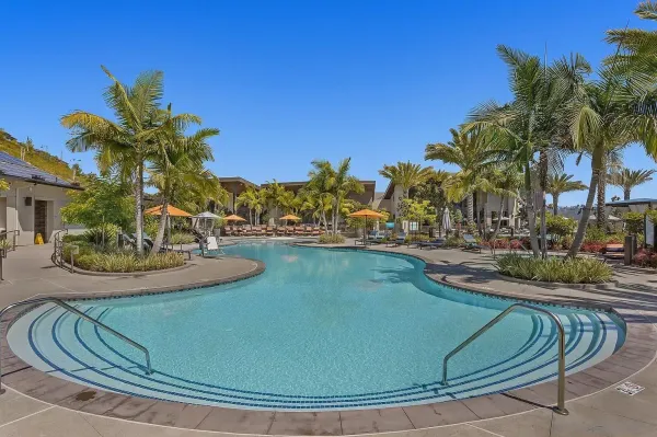 a view of a swimming pool with outdoor seating