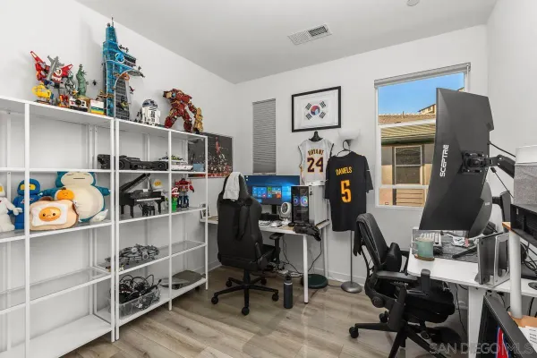 a view of a workspace with furniture and toys