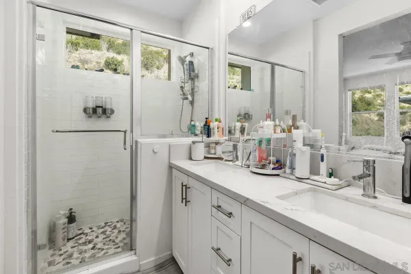 a kitchen with a sink and a refrigerator