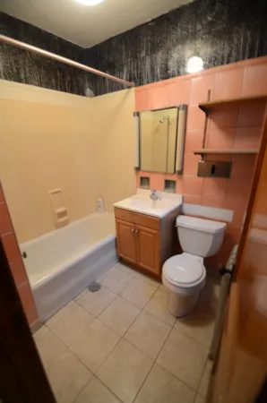 a bathroom with a toilet a sink and a bathtub