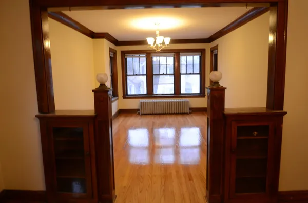 a view of empty room with a large window