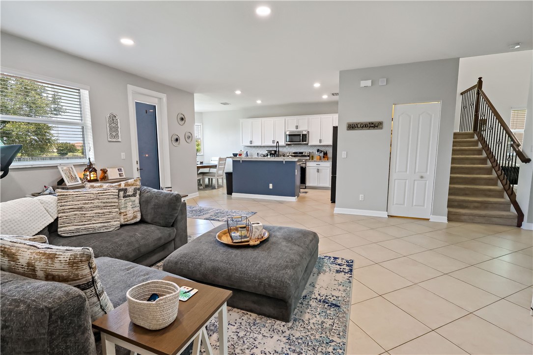 1782 Berkshire Circle Southwest Vero Beach, FL 32968 - Photo 11 of 35 a living room with furniture and a wooden floor