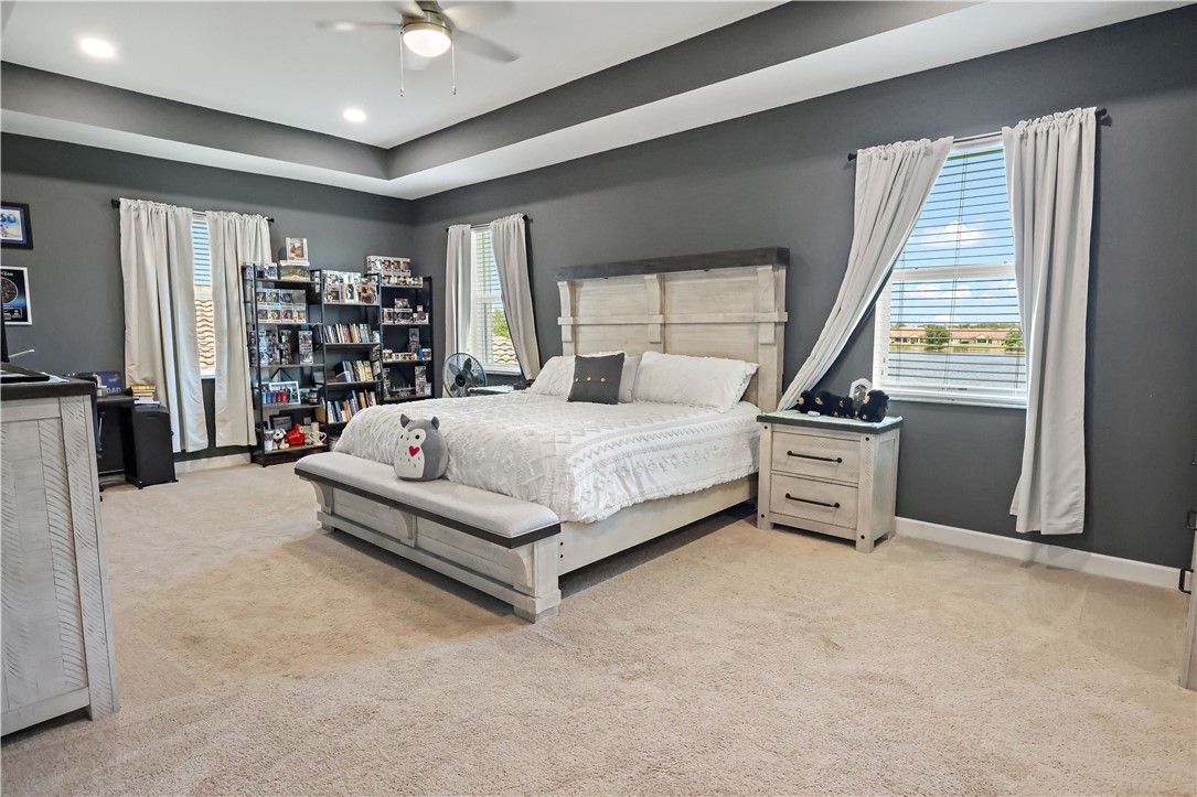 1782 Berkshire Circle Southwest Vero Beach, FL 32968 - Photo 15 of 35 a bedroom with a bed closet and a window