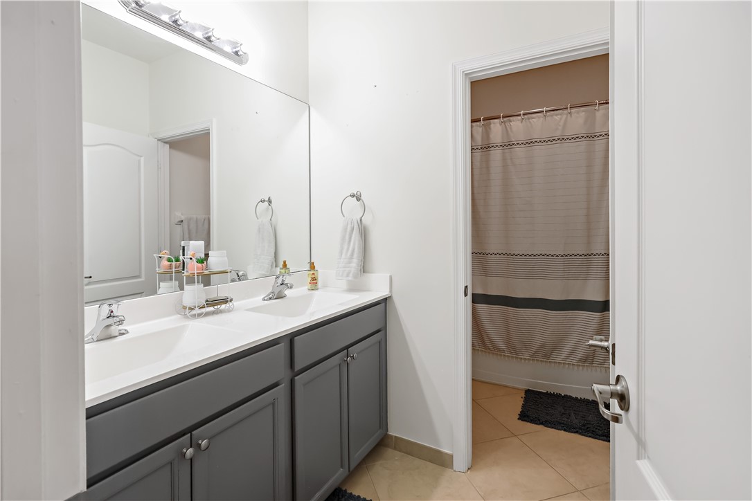 1782 Berkshire Circle Southwest Vero Beach, FL 32968 - Photo 23 of 35 a bathroom with a sink and a mirror