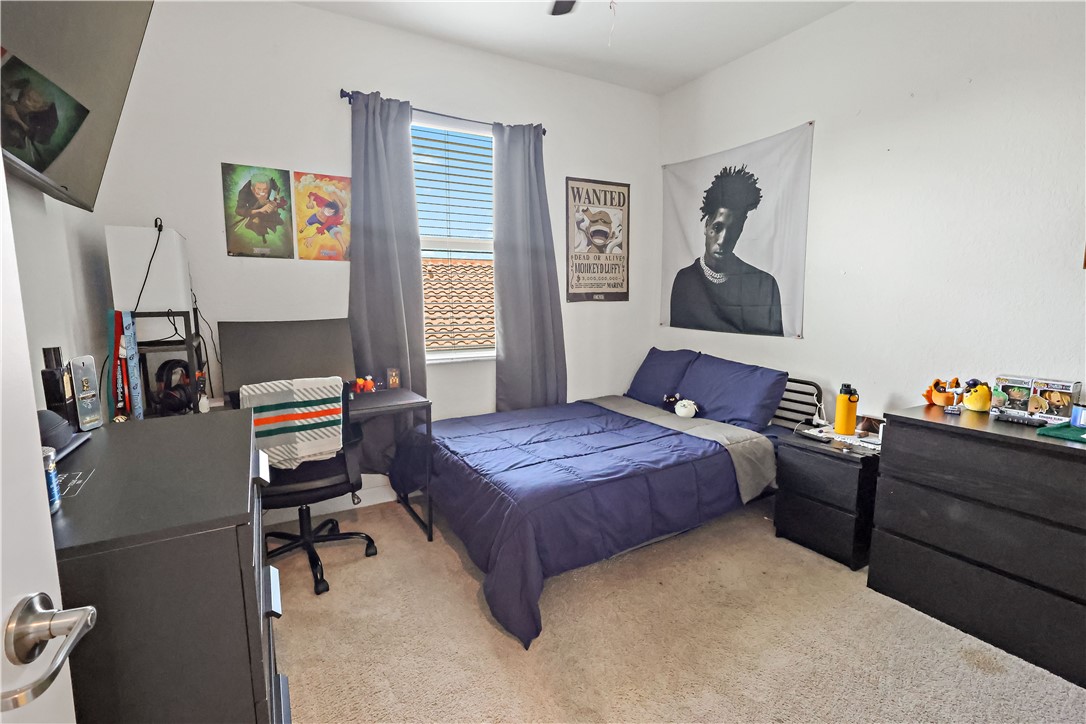 1782 Berkshire Circle Southwest Vero Beach, FL 32968 - Photo 24 of 35 a bedroom with a bed and a window