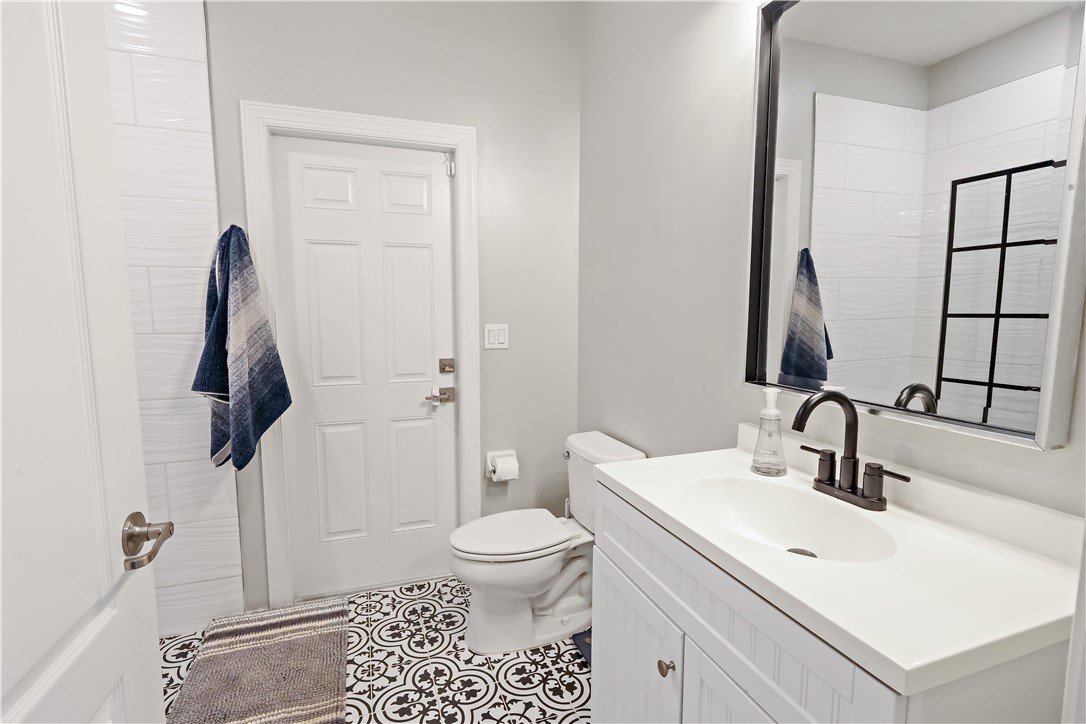 1782 Berkshire Circle Southwest Vero Beach, FL 32968 - Photo 25 of 35 a bathroom with a sink toilet and shower