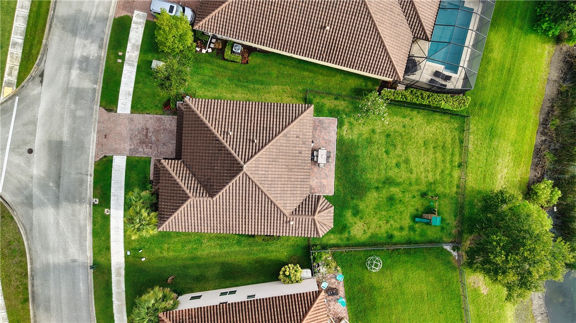 1782 Berkshire Circle Southwest Vero Beach, FL 32968 - Photo 32 of 35 a aerial view of a house with backyard