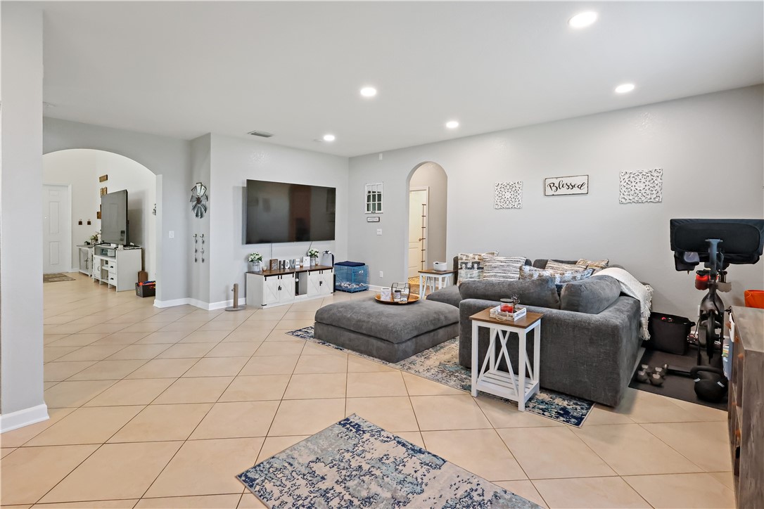 1782 Berkshire Circle Southwest Vero Beach, FL 32968 - Photo 8 of 35 a living room with furniture and a flat screen tv