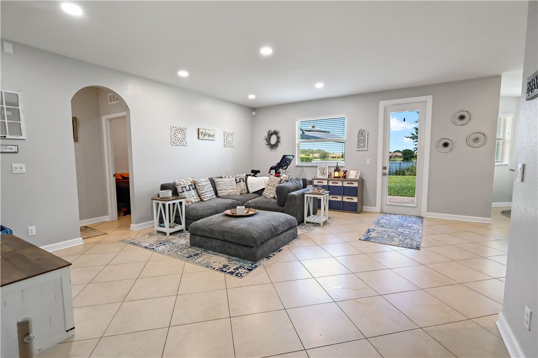 1782 Berkshire Circle Southwest Vero Beach, FL 32968 - Photo 9 of 35 a living room with furniture and white walls