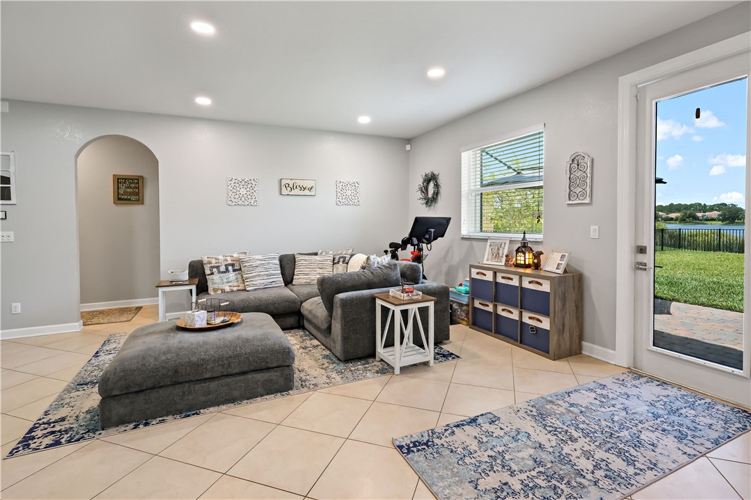 1782 Berkshire Circle Southwest Vero Beach, FL 32968 - Photo 10 of 35 a living room with furniture and a window