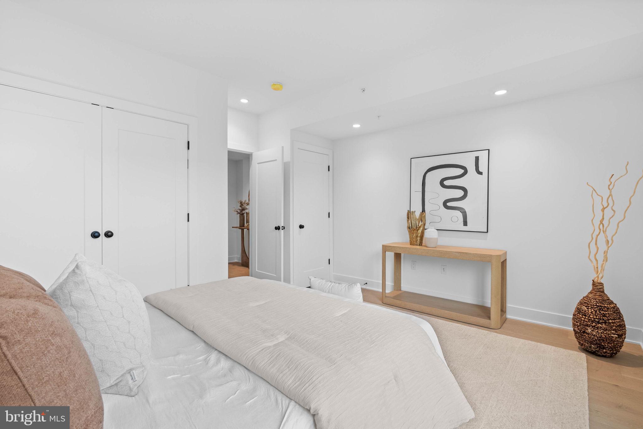 650 Fairmount Avenue, Unit J2 Philadelphia, PA 19123 - Photo 23 of 56 a bedroom with a bed and a table