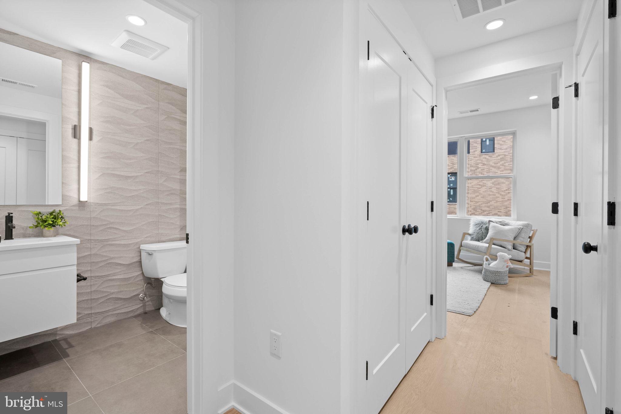 650 Fairmount Avenue, Unit J2 Philadelphia, PA 19123 - Photo 25 of 56 a bathroom with a toilet sink and mirror