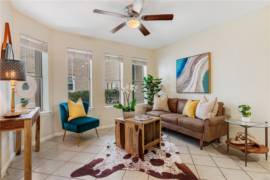 2104 Cullen Avenue, Unit 116 Austin, TX 78757 - Photo 1 of 1 a living room with furniture and a potted plant