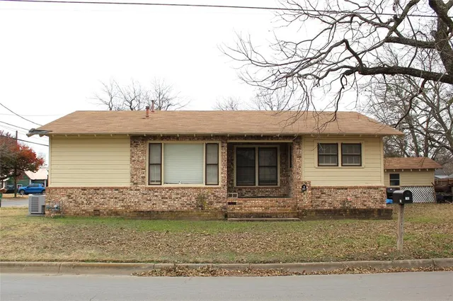 a front view of a house with garage